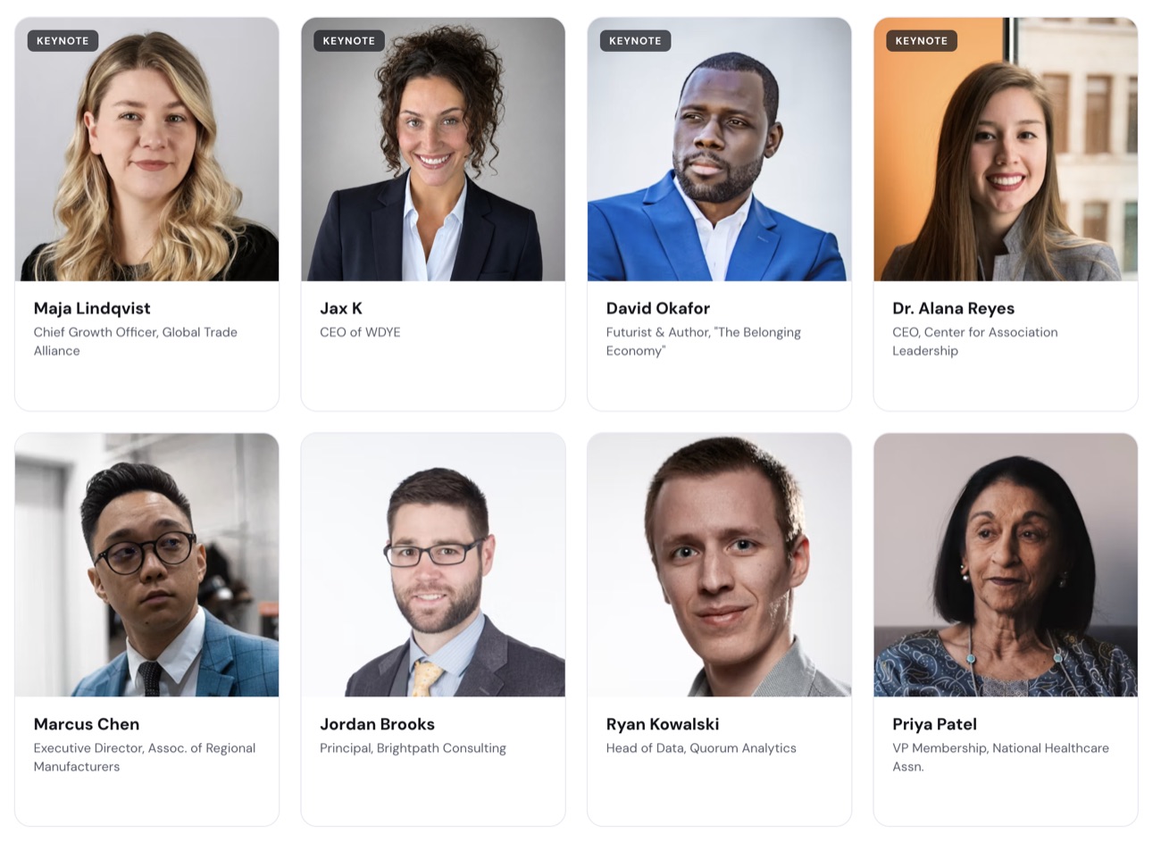 The speaker wall on a published event site: a grid of headshot cards with keynote badges, names, titles and organizations